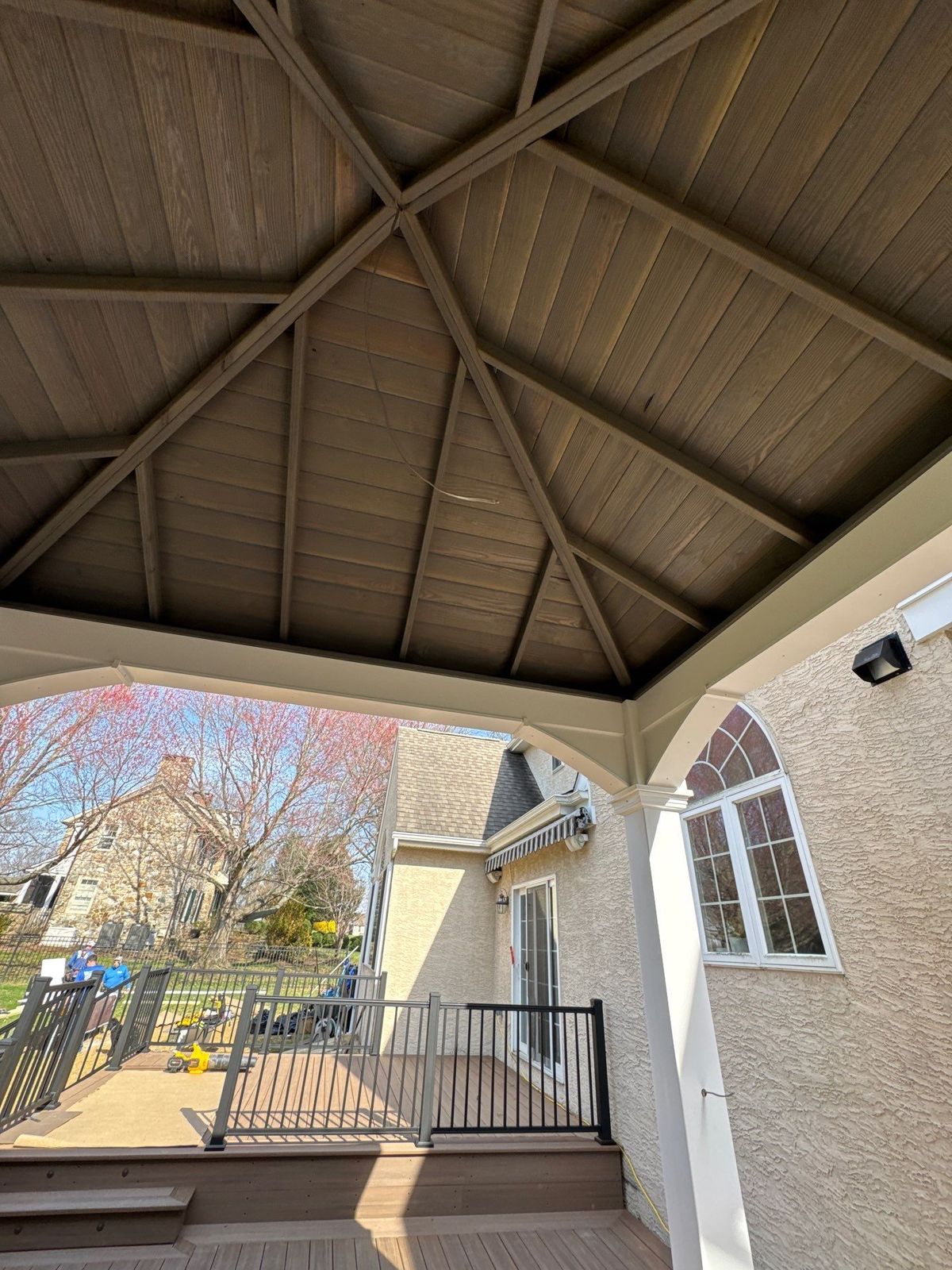 Covered porch builder Chester County PA — roofed porch with finished vaulted ceiling and aluminum railing